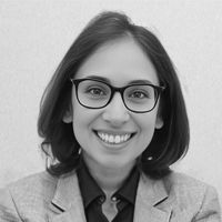 A headshot of Dr. Zehra Nizami in greyscale.