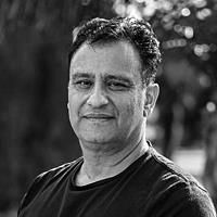 A greyscale headshot of Farshid Sabet