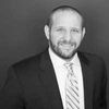 Black and white headshot of Andrew Anderson.