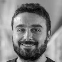 Black and white headshot of Angelo Raggioli.