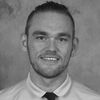 Headshot of Dr. Nathan Basisty in greyscale.