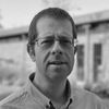A greyscale headshot of Phil Hargreaves