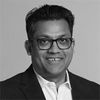 Black and white headshot of Ravi Gupta.