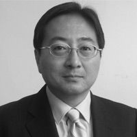 A greyscale headshot of Toru Suzuki