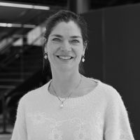 Smiling woman in casual sweater for professional headshot portrait.