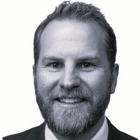 A greyscale headshot of Kevin Rynearson