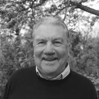 A greyscale headshot of Michael Butler