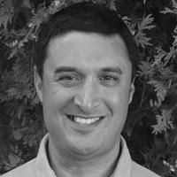 Greyscale headshot of Amrik Singh, PhD