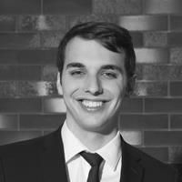A greyscale headshot of Andrew Siemers