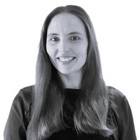 A greyscale headshot of Poppy Cooper