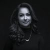 A greyscale headshot of Vandana Arcot