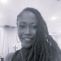 A greyscale headshot of Linda Elisee