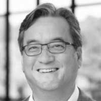 Black and white headshot of Patrick Hurban.