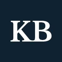 White capital K and B letters on a navy background.