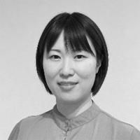 A greyscale headshot of Nozomi Maeshima