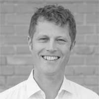 Black and white headshot of Tilmann Burckstummer.
