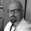 A greyscale headshot of Alexandre Giordana