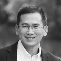 Black and white headshot of E.K. Koh.