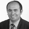 A greyscale headshot of Ahmet F. Coskun