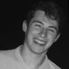 A greyscale headshot of Andrew Leduc